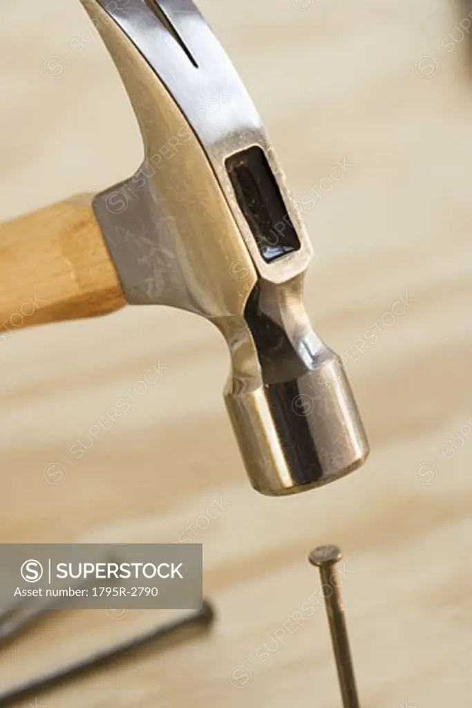Closeup of hammer and nail