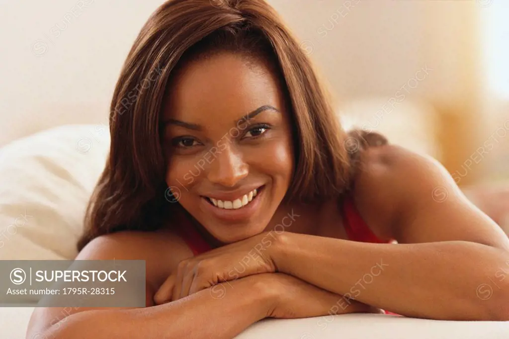 Beautiful woman relaxing on her bed