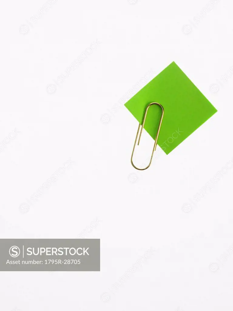 Paper clip and green paper