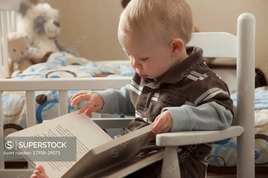 Toddler looking at a book