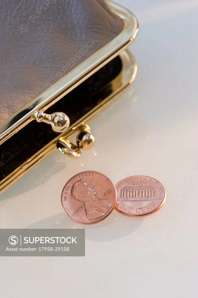 Pennies beside change purse