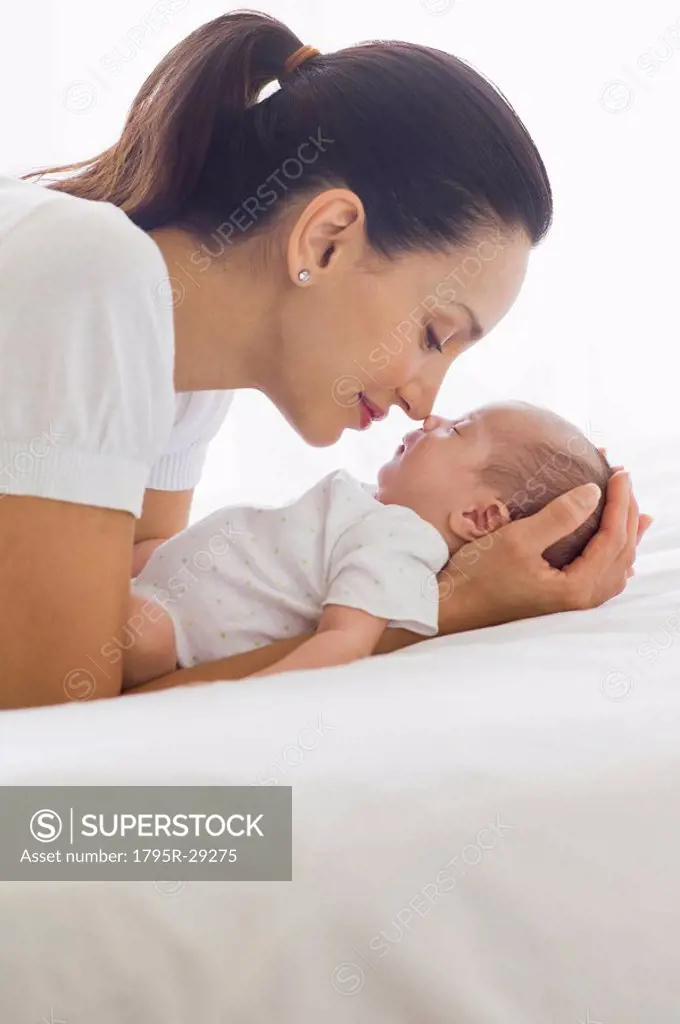 Mother holding her sleeping baby