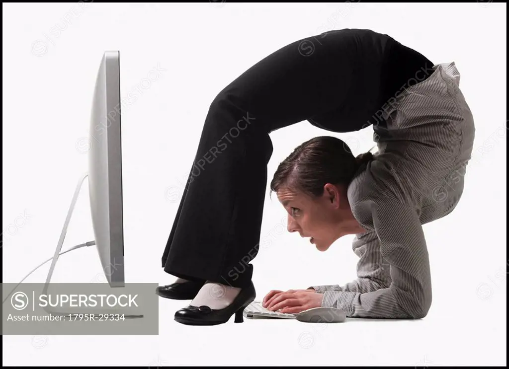 Businesswoman bending over backwards