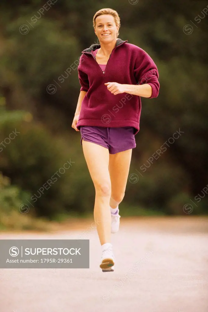 Woman jogging down the street