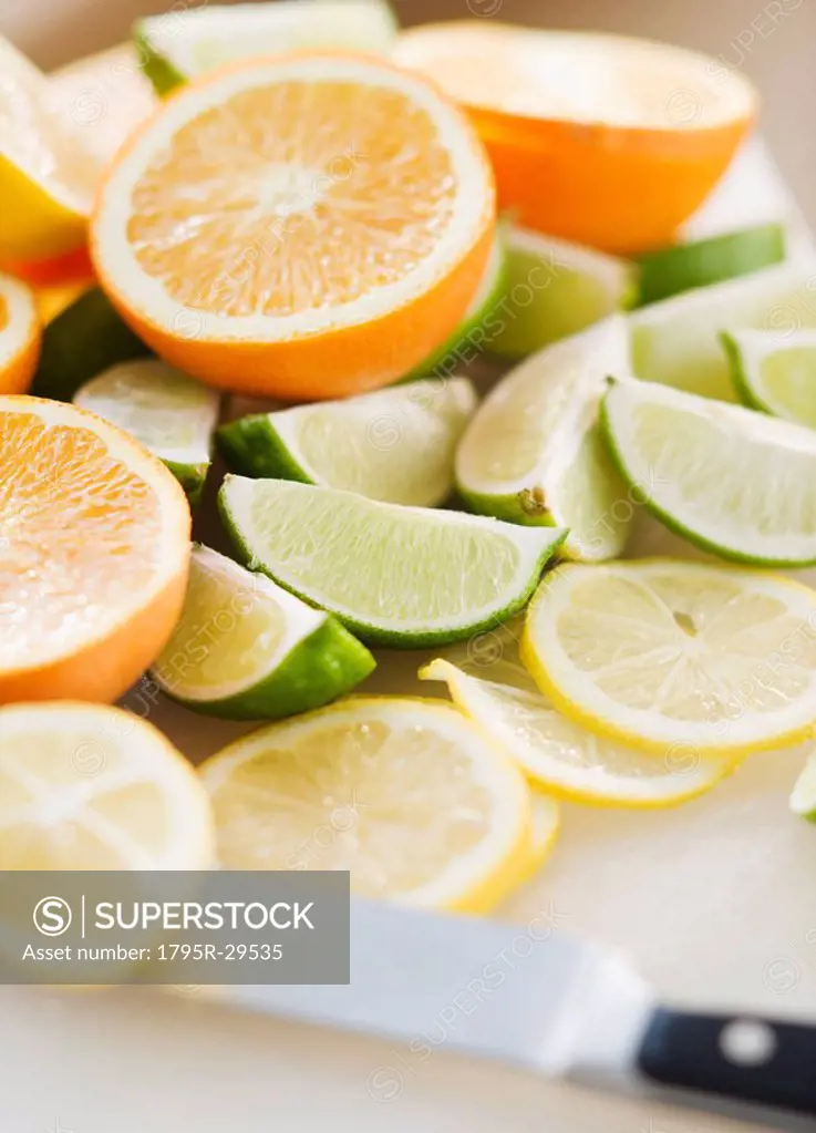 Freshly cut lemons limes and oranges