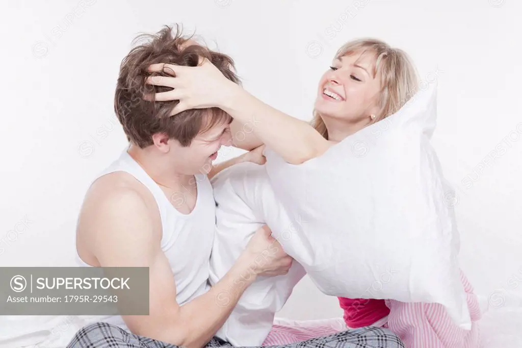 Couple having a pillow fight