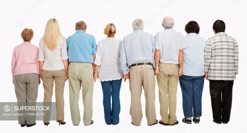 Rear view of people standing in a row