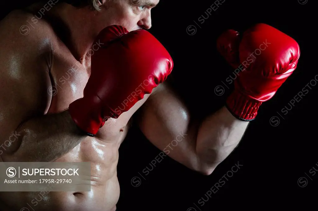 Boxer wearing red boxing gloves