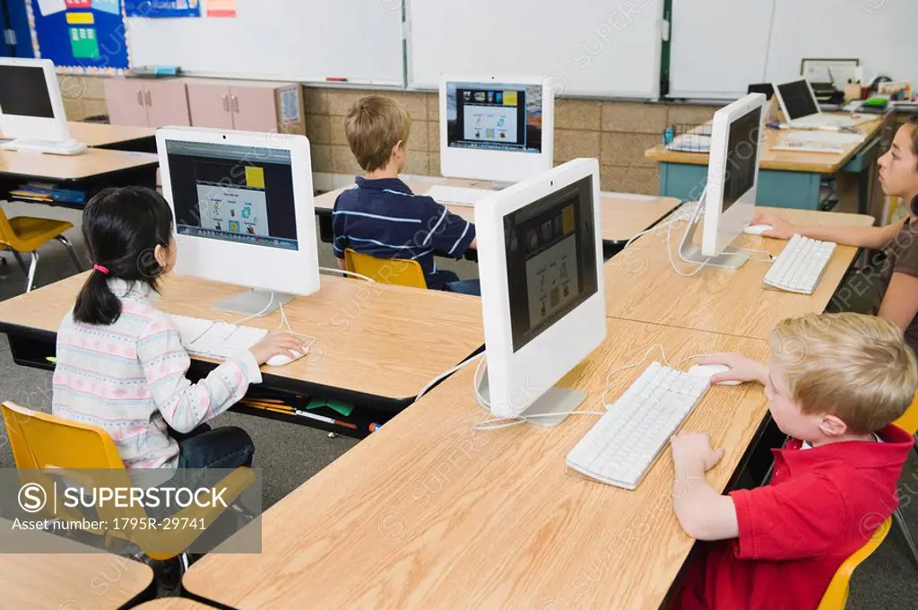 Children working at computers in classroom