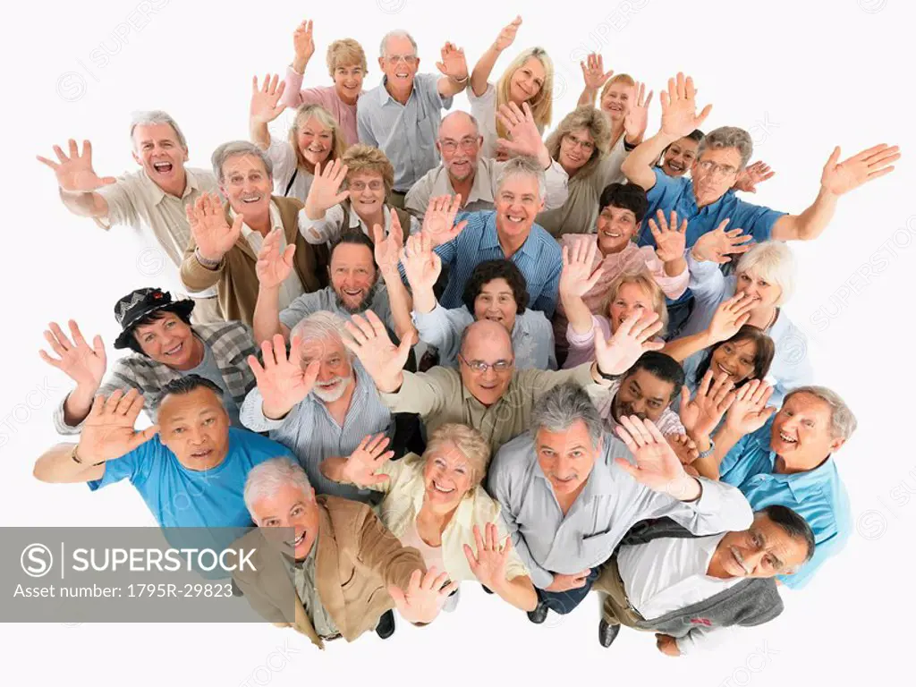 A group of people waving while looking up