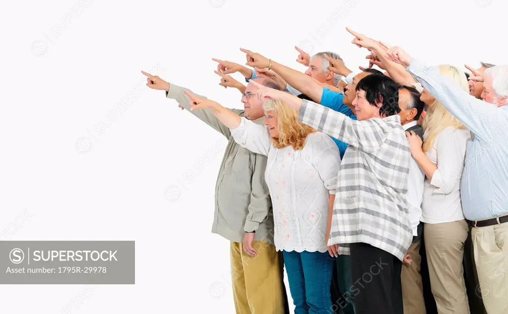 A group of people pointing
