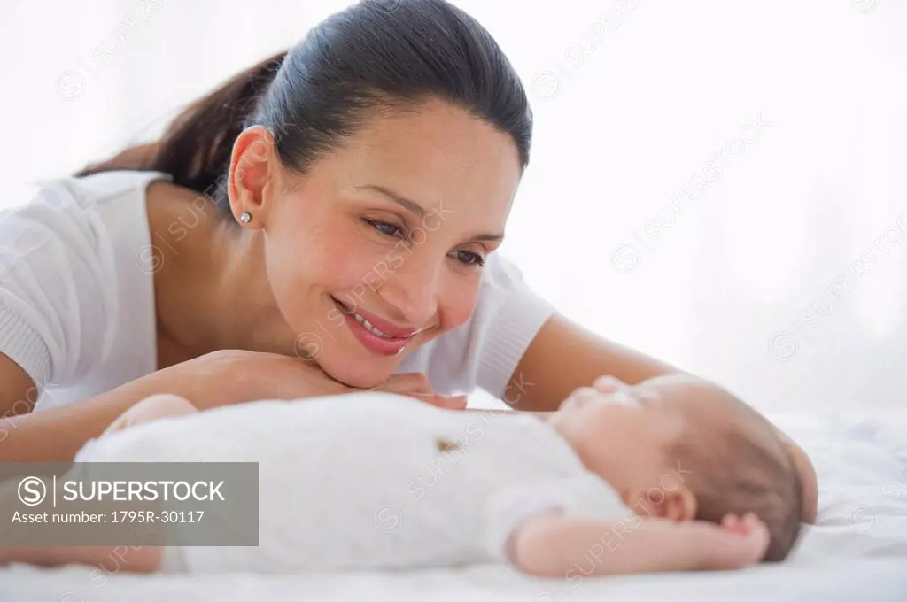 Mother watching her baby sleep