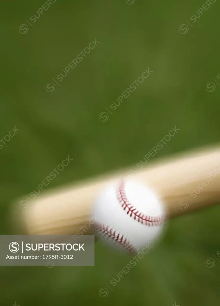 Closeup of bat hitting baseball