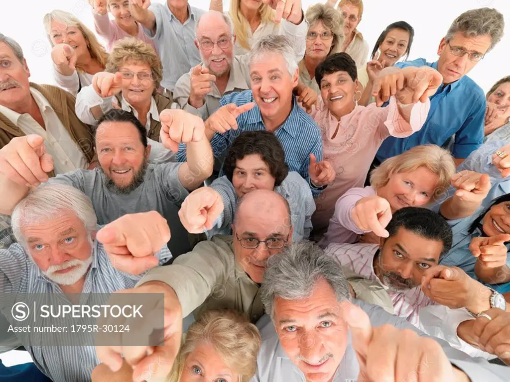 A group of people pointing up
