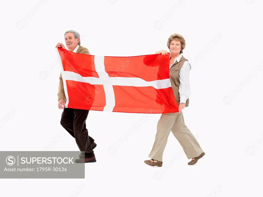 Two people carrying the Denmark flag