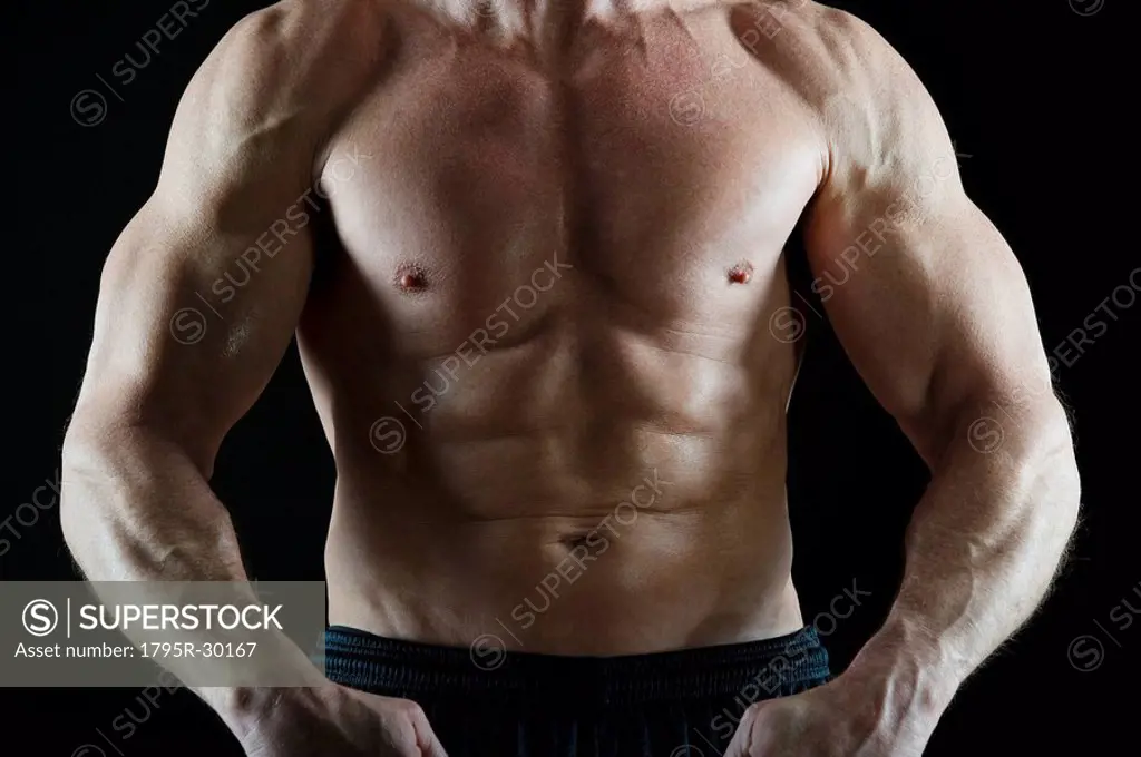 Muscular man flexing his muscles