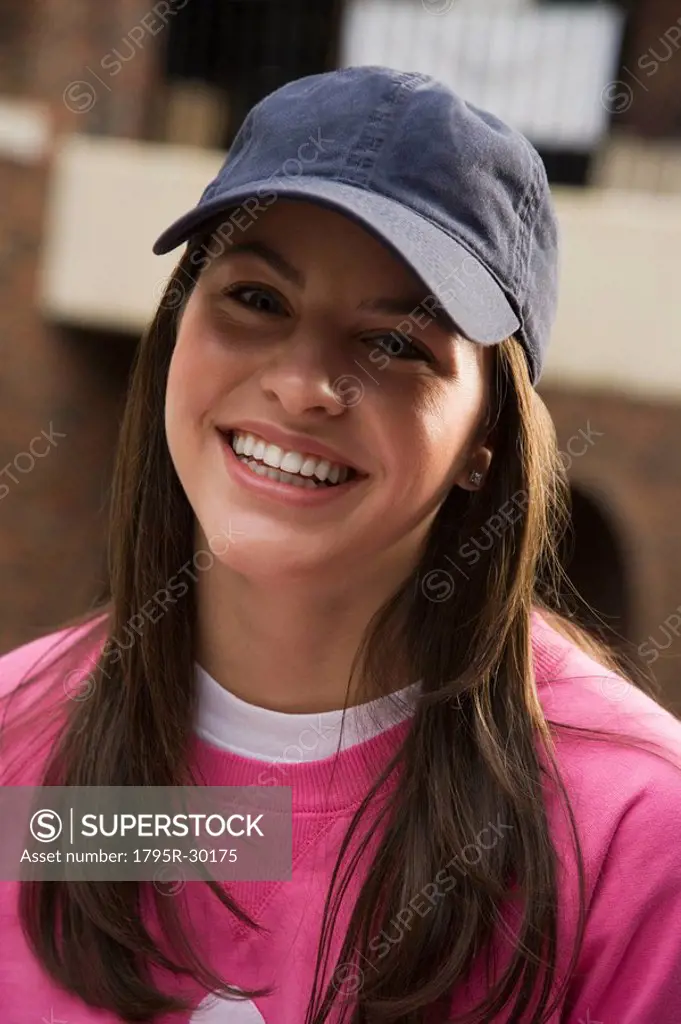 Pretty teenage girl wearing a ball cap
