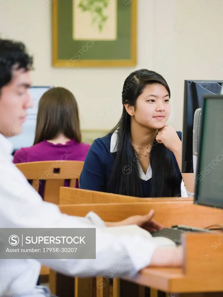 College students working in library