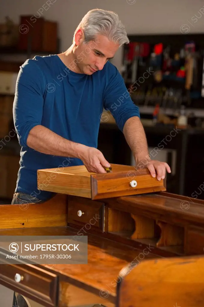 Craftsman fixing a piece of furniture