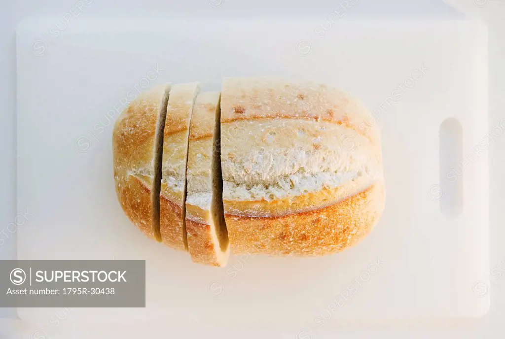 Freshly sliced bread on cutting board