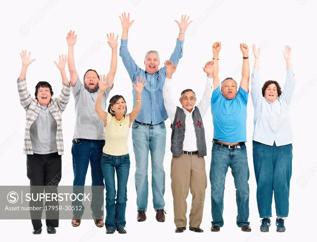 A group of people jumping with their arms raised