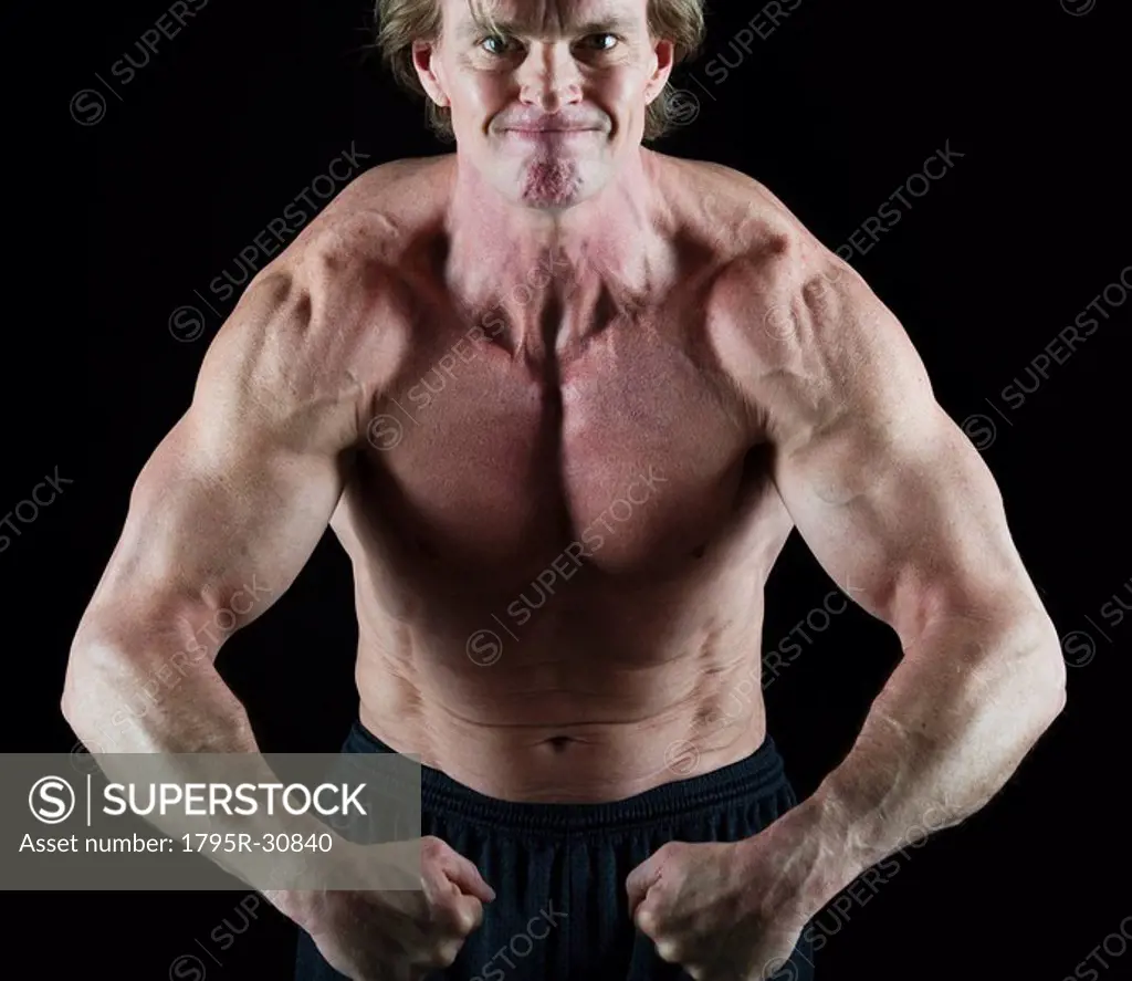 Muscular man flexing his muscles
