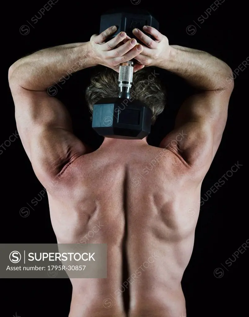 Man lifting free weight behind his head