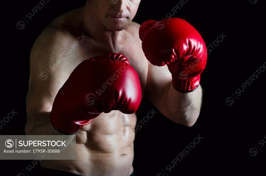 Boxer wearing red boxing gloves
