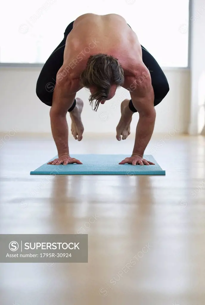 Man doing workout on yoga mat
