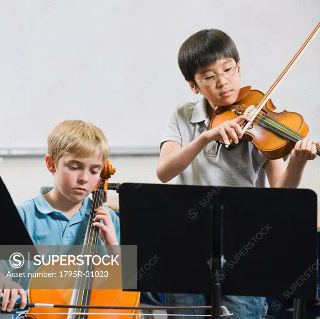 Elementary school students playing instruments in music class