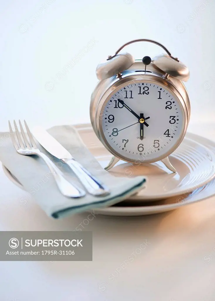 Alarm clock on plate