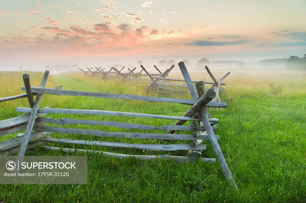 Rustic fence in field