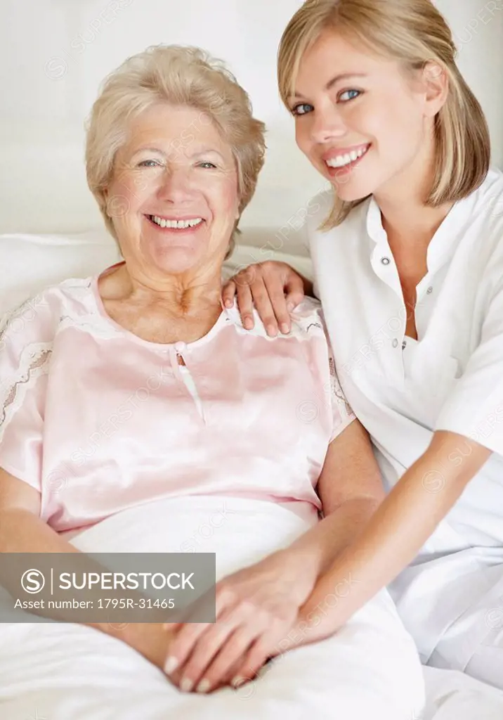 Nurse sitting with a senior woman