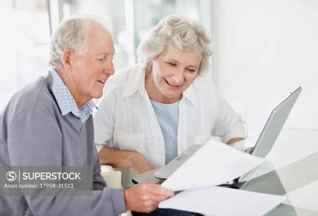 Senior couple doing paperwork together