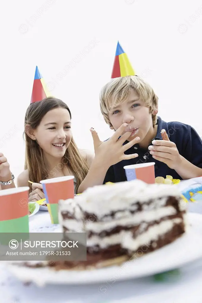 Children eating birthday cake