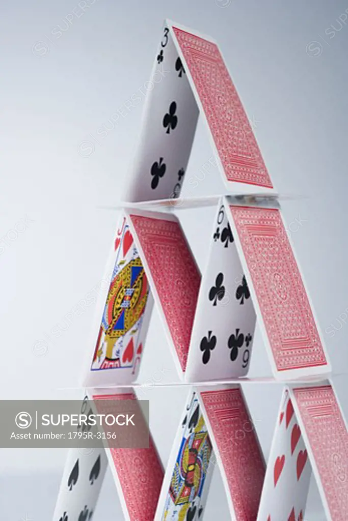 Playing cards stacked into a pyramid