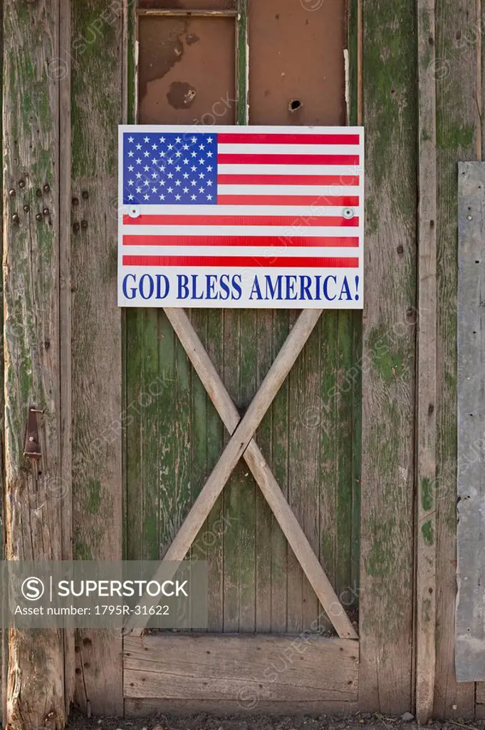 God bless American sign on barn door