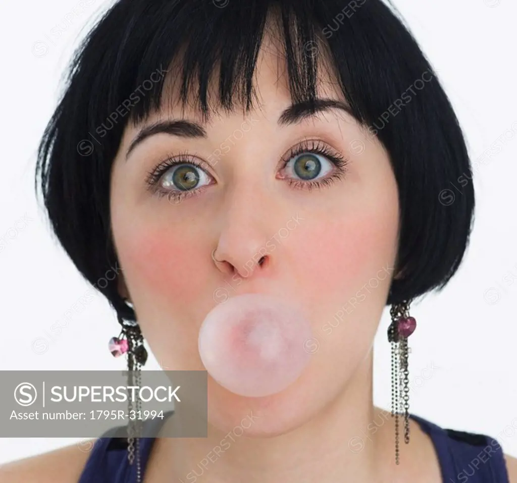 Woman blowing a bubble with bubble gum