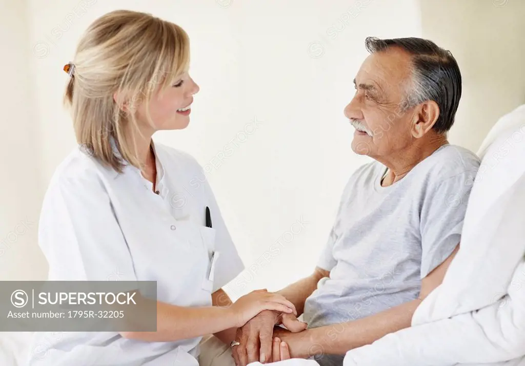 Nurse sitting with patient