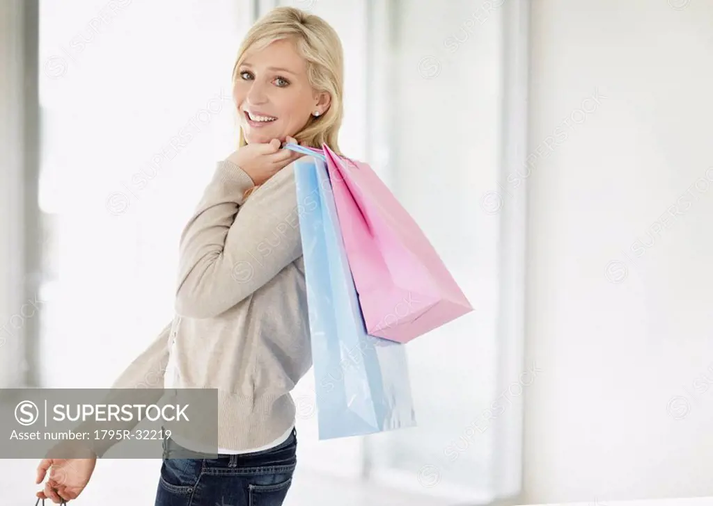 Attractive woman holding shopping bags