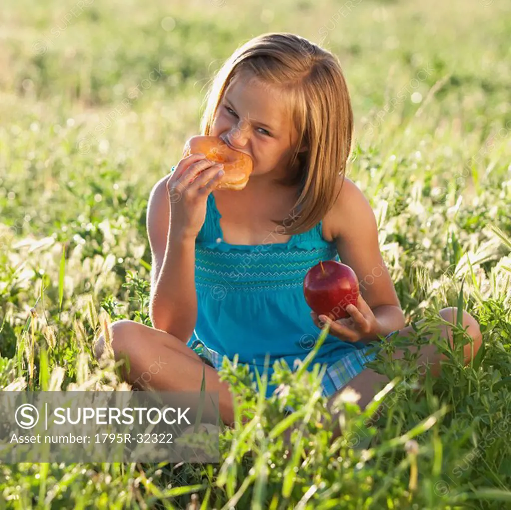 Young girl eating a doughnut