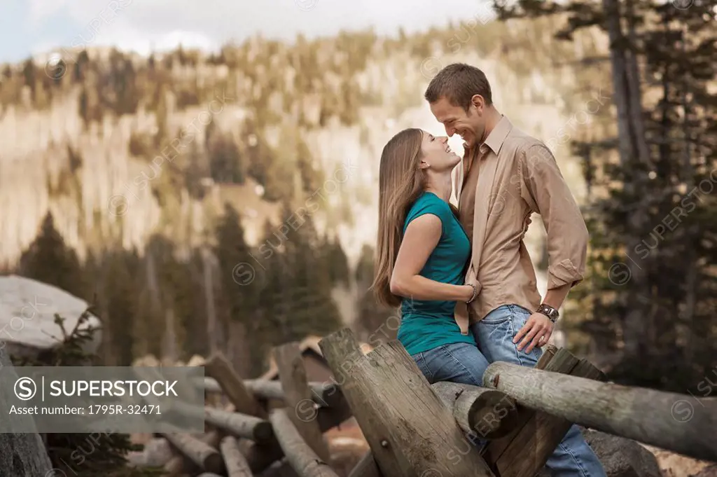 Happy couple embracing in rural setting