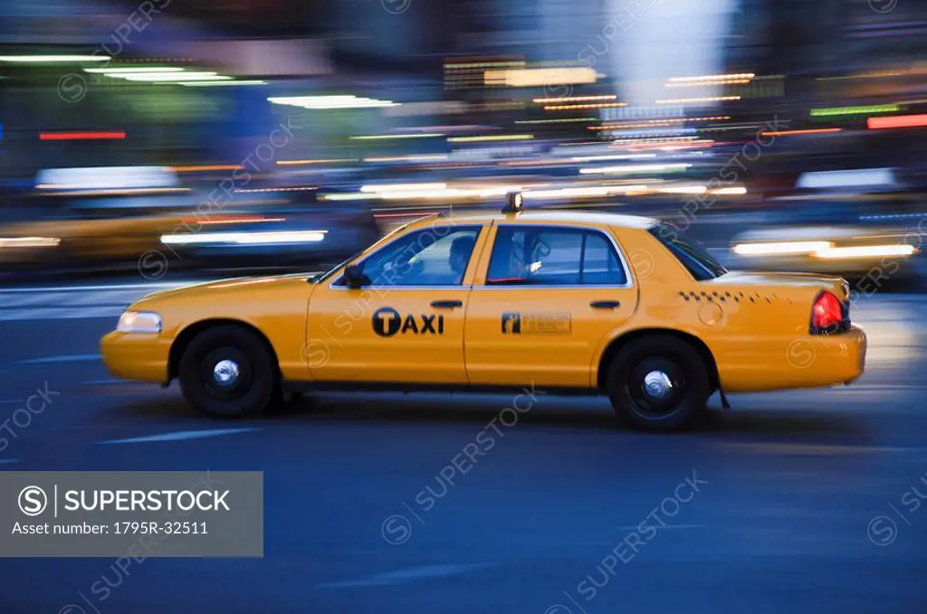 Taxi cab driving in the evening