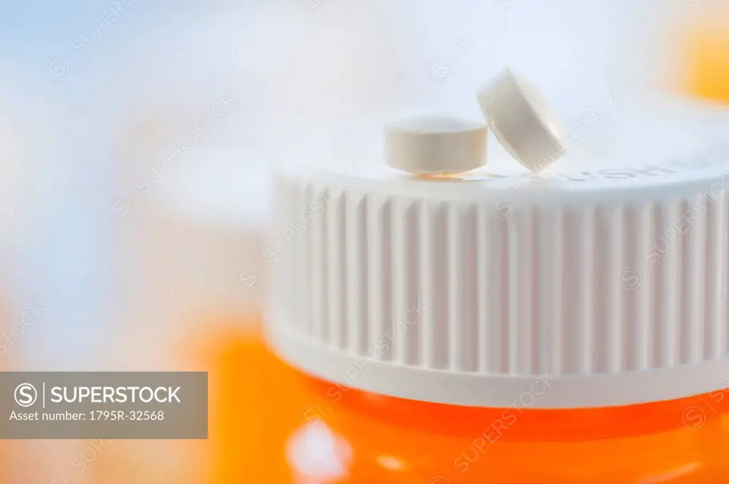 Pills on top of bottle of prescription medication
