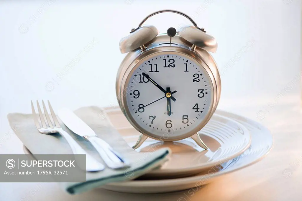 Alarm clock on plate