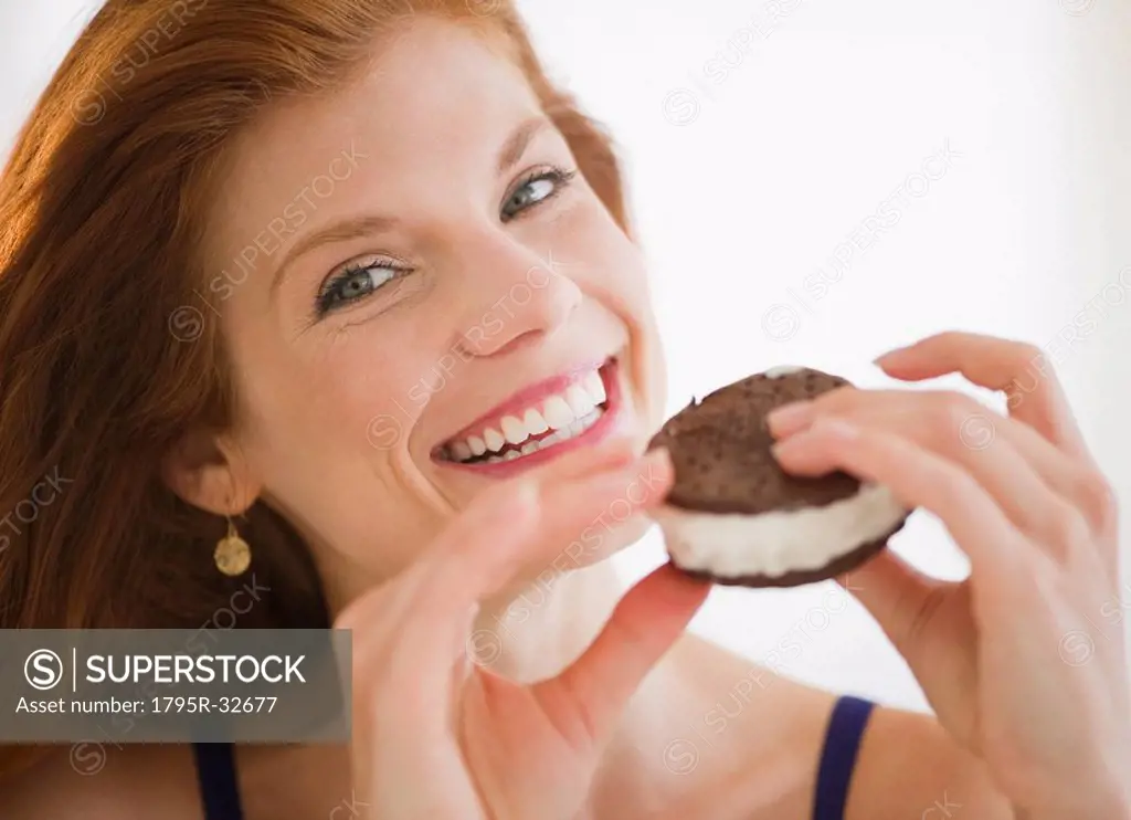 Woman eating an ice cream sandwich