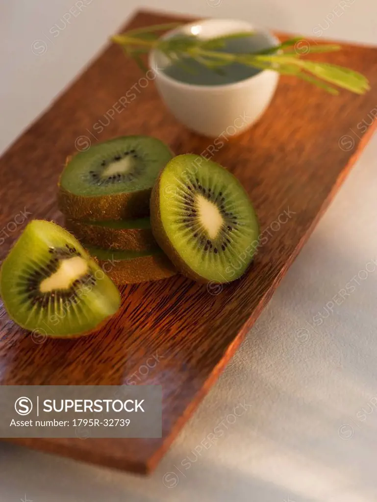 Kiwi slices on wooden tray