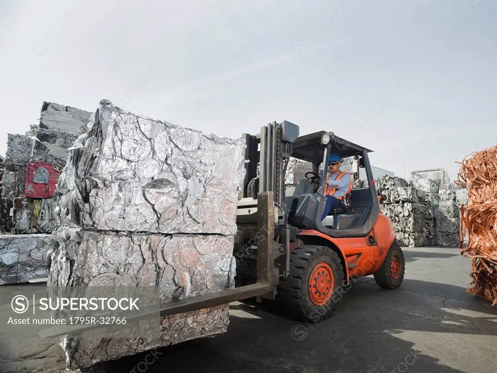 Forklift driver at recycling plant