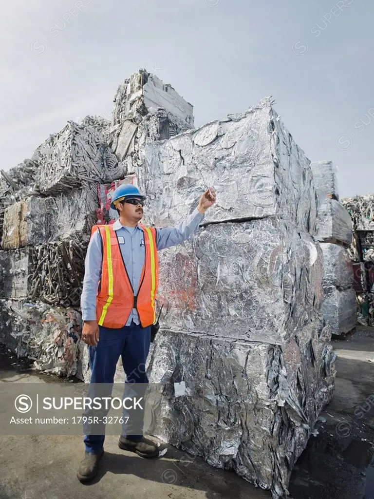 Worker at recycling plant