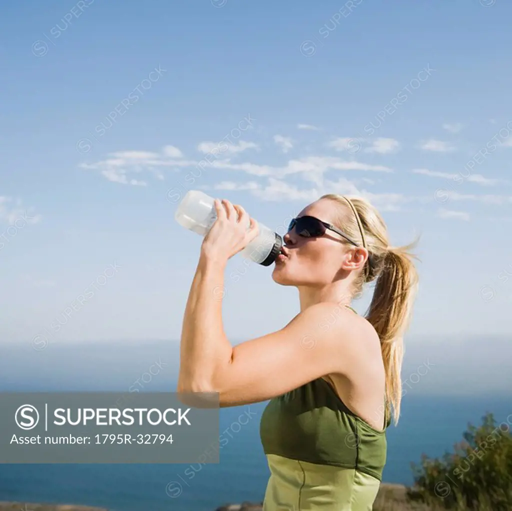 Runner having a drink of water